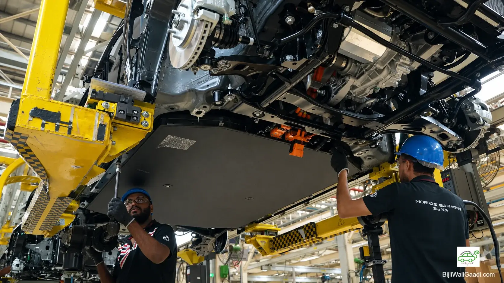 High-resolution image showing technicians installing an EV battery pack beneath an MG electric vehicle on the production line.